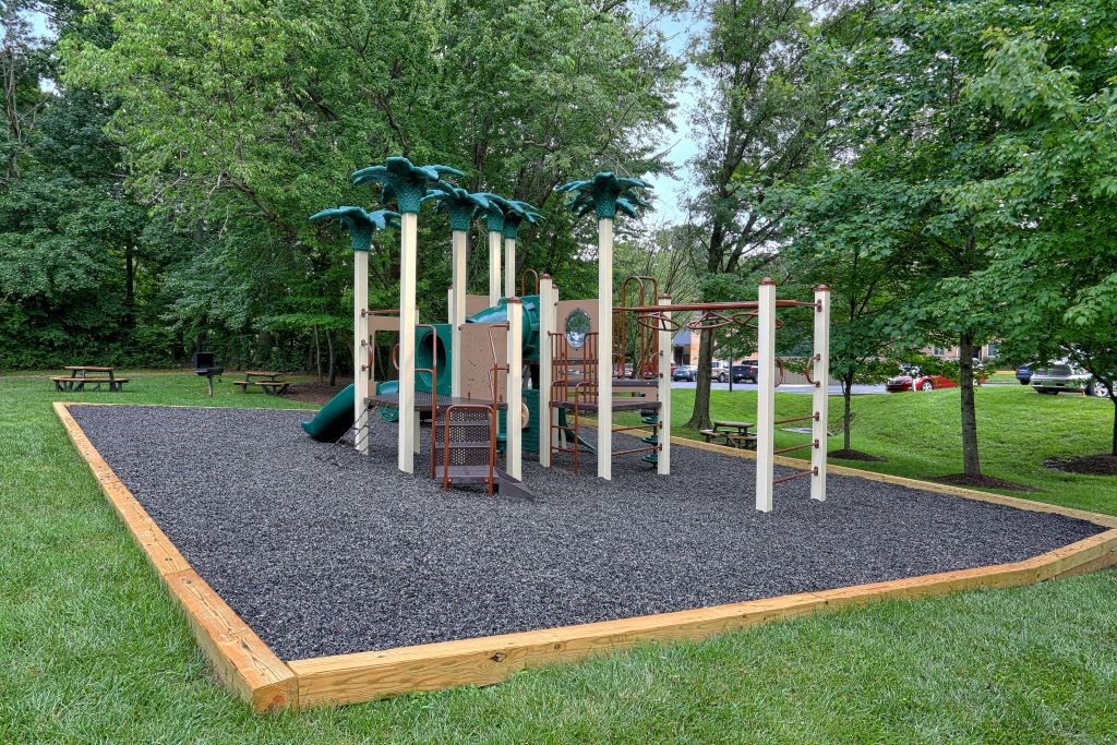 a playground with a set of play equipment in a park