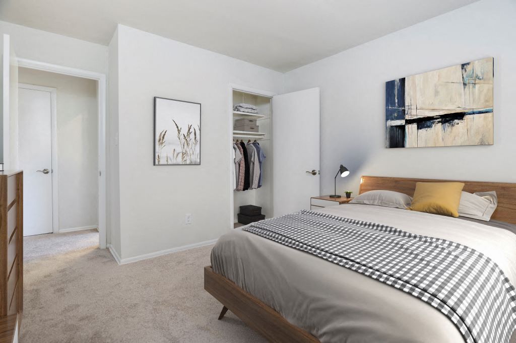 a bedroom with a bed and a closet