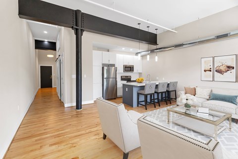 A modern kitchen with a dining table and chairs.