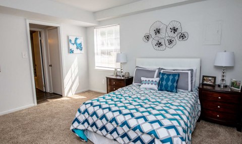 a bedroom with a bed and a closet