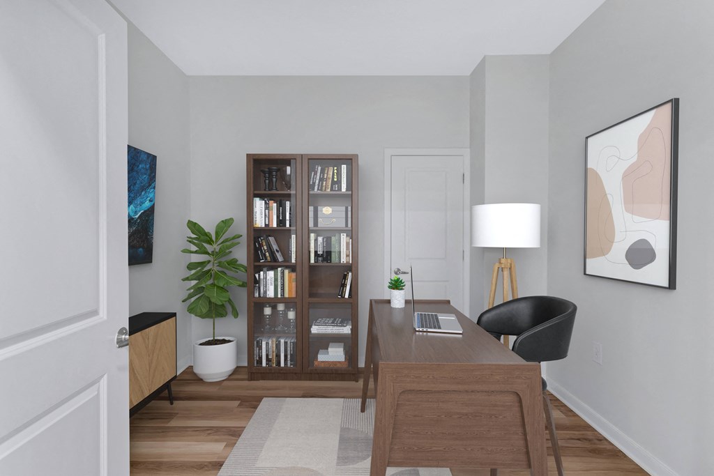a home office with a wooden desk and a bookcase