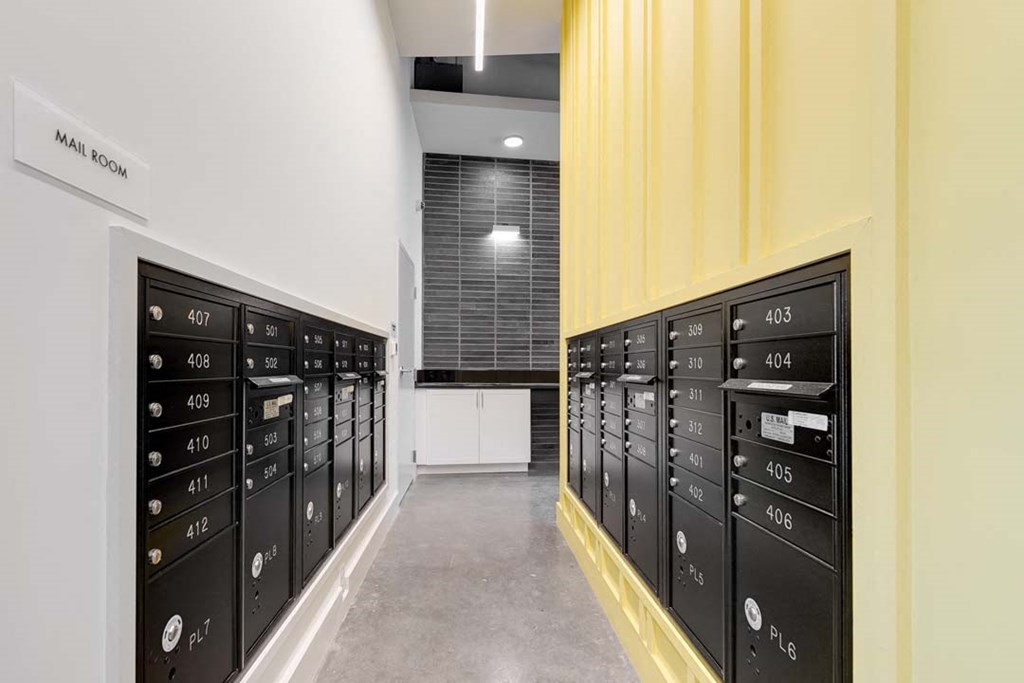 a row of lockers in a hallway with a window in the background