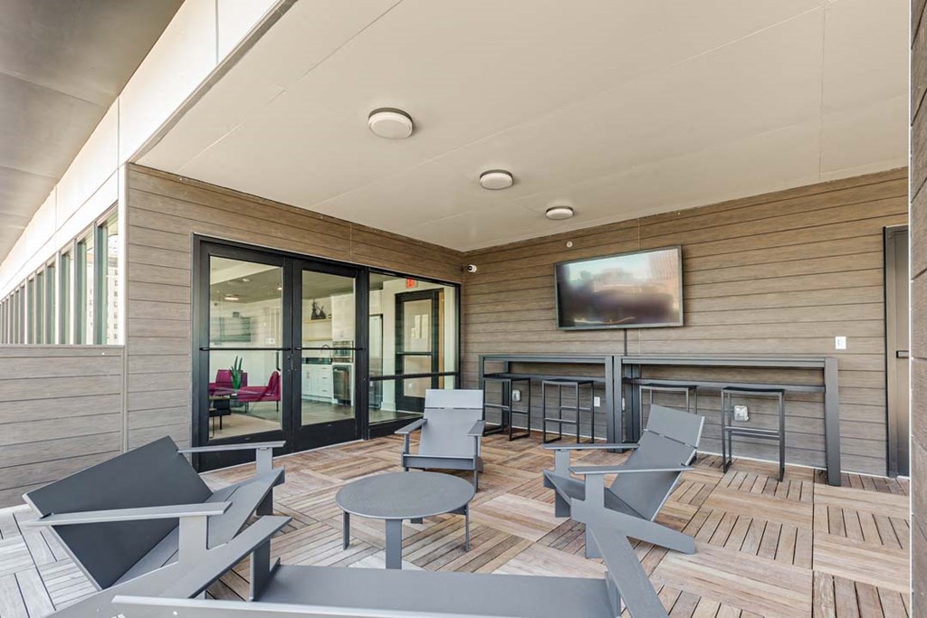 a room with a bunch of chairs and a tv on the wall