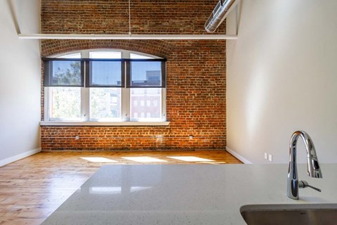 a bathroom with a large window and a sink