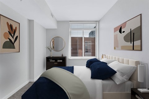 a bedroom with a large bed and a window