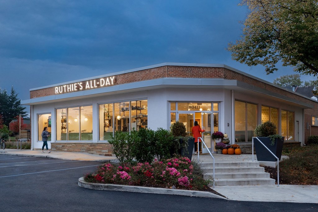 the front of a all day building at night