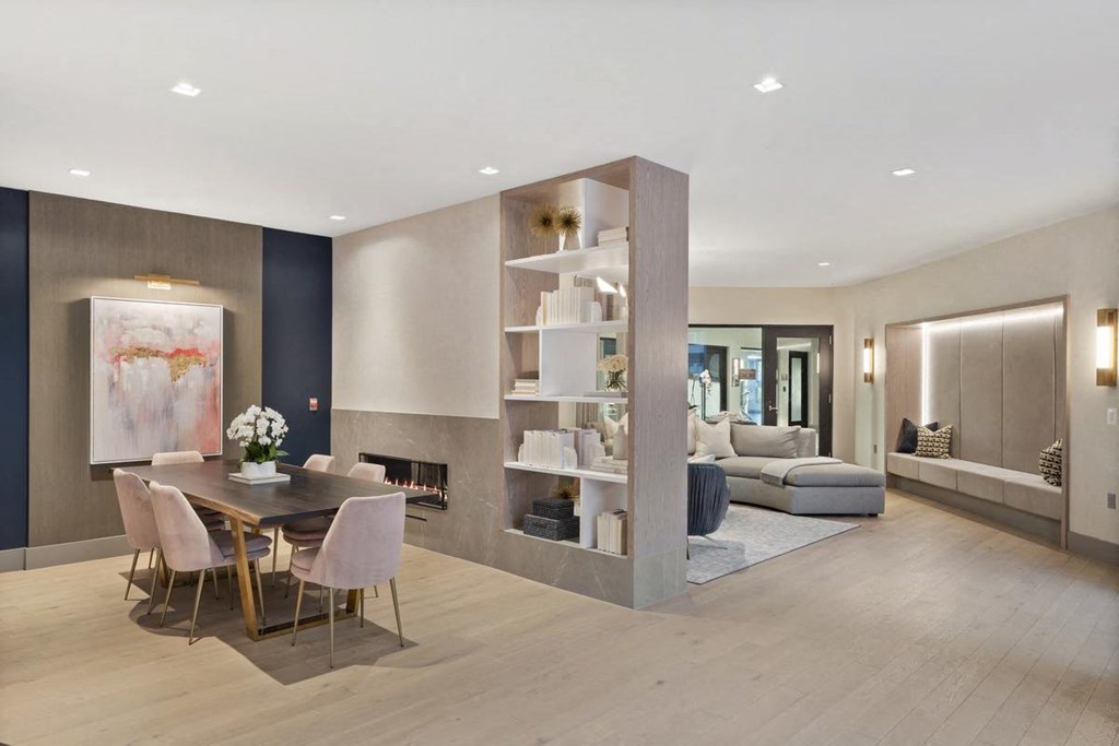 a dining room and living room with a table and chairs