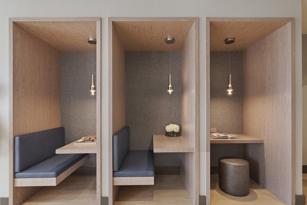 a small restaurant with two booths and a table with two benches