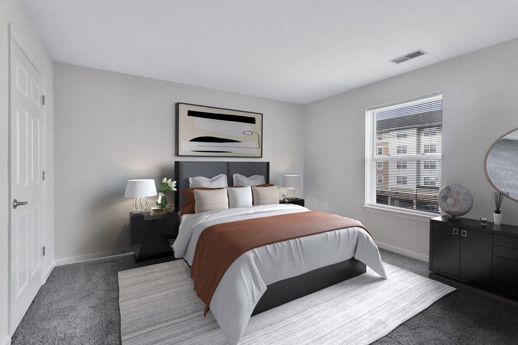 a bedroom with a bed and a window