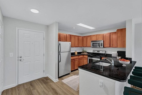 a kitchen with a sink and a refrigerator