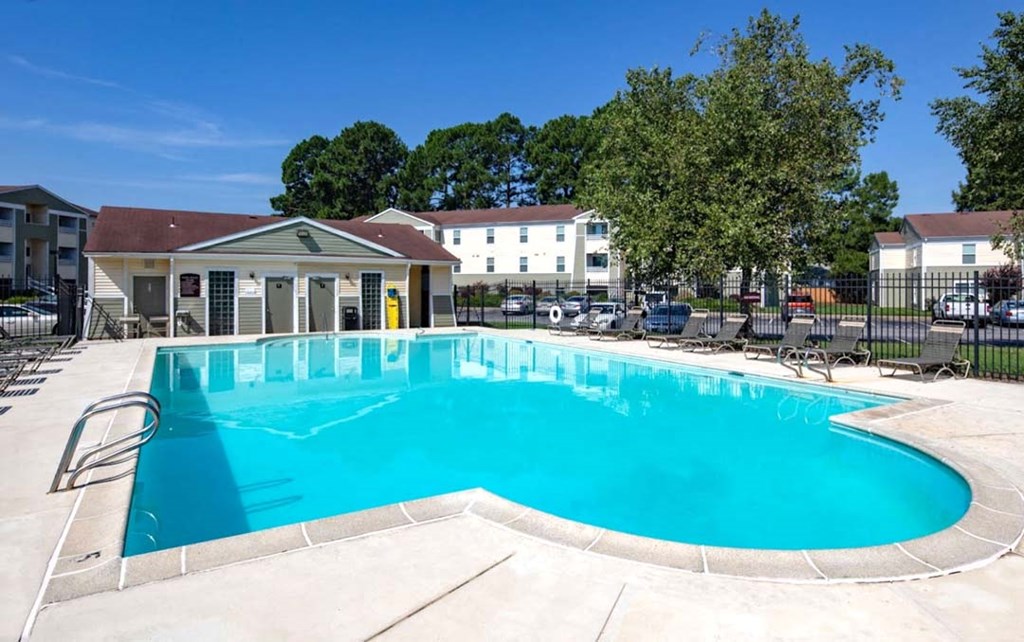 A small pool with a yellow diving board.