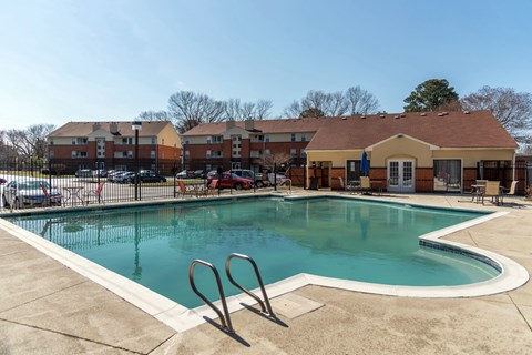 the preserve at ballantyne commons community swimming pool with apartment buildings in the background