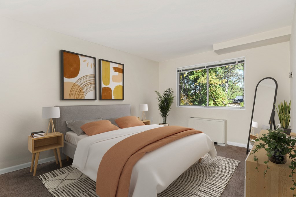 an image of a bedroom with a bed and a window