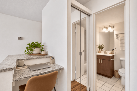A bathroom with a sink and a mirror.