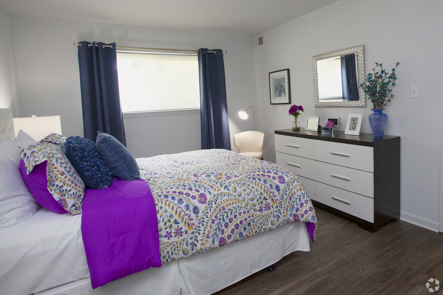 a bedroom with a bed and a dresser