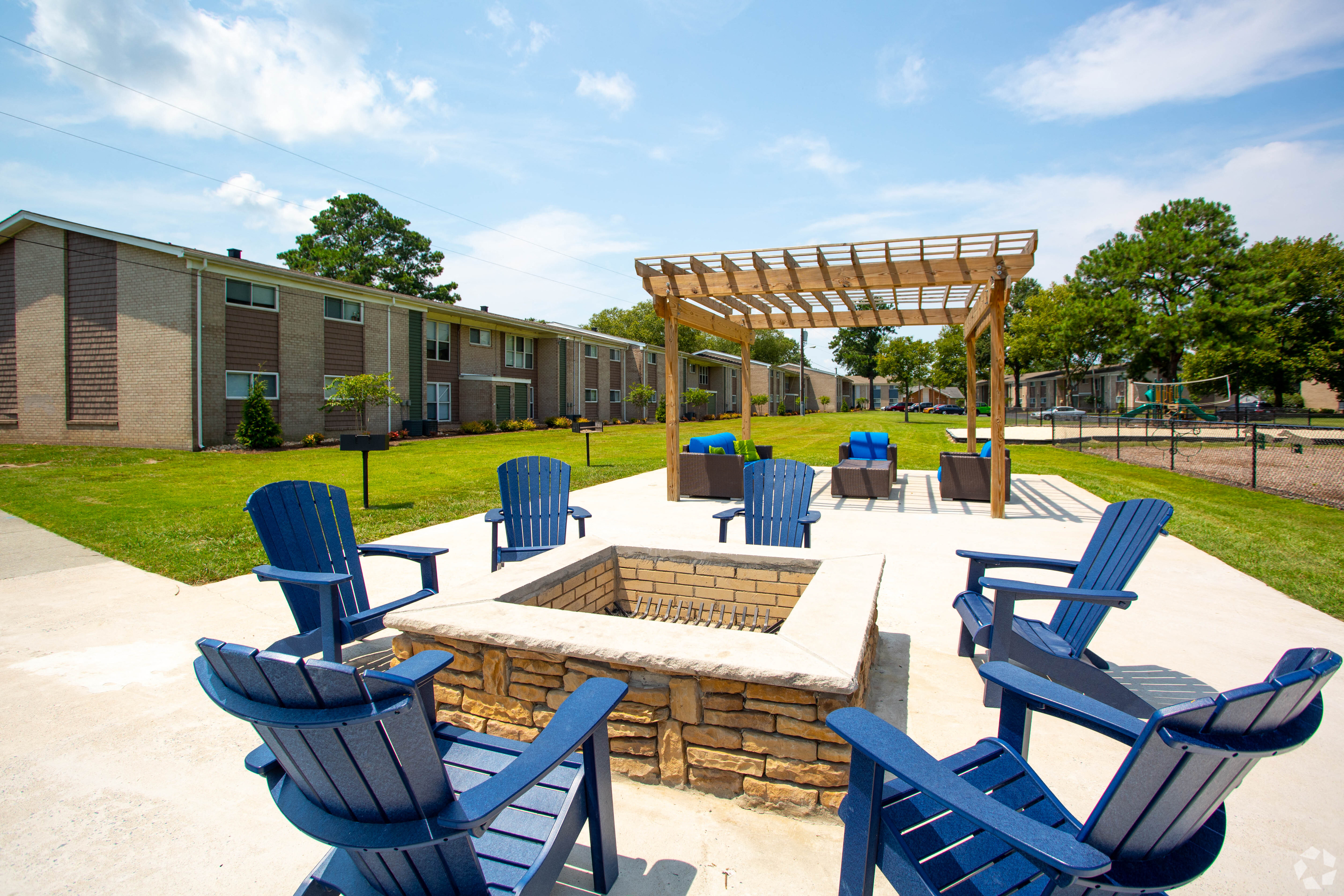 the reserve at bucklin hill patio with firepit and blue adirondack chairs