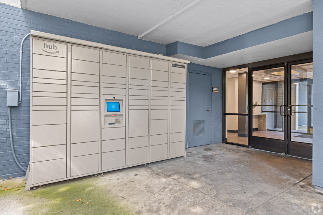 a set of lockers in front of a door in a building