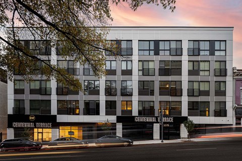 a large white and black building on a city street