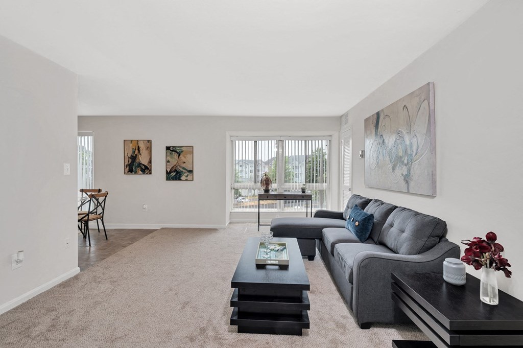 a living room with a grey couch and a coffee table