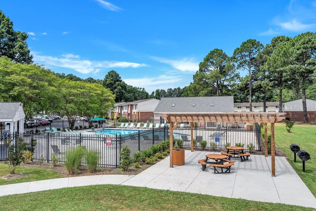 our apartments have a pool and a patio with picnic tables