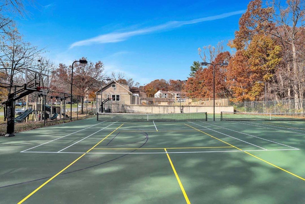 the tennis court is clean and ready for players to play
