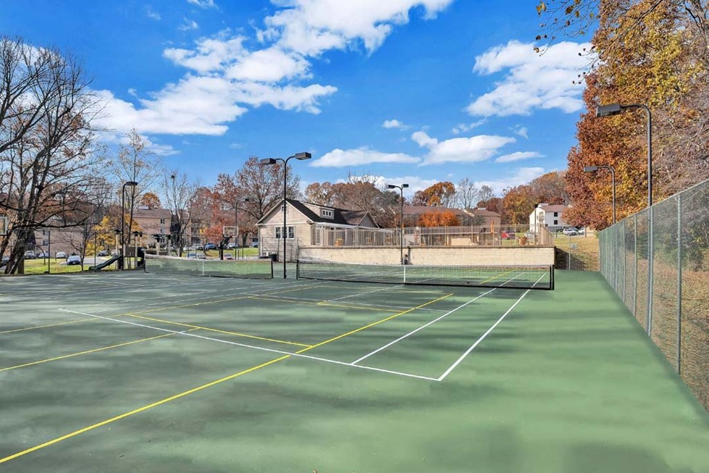 the tennis court is clean and ready to play