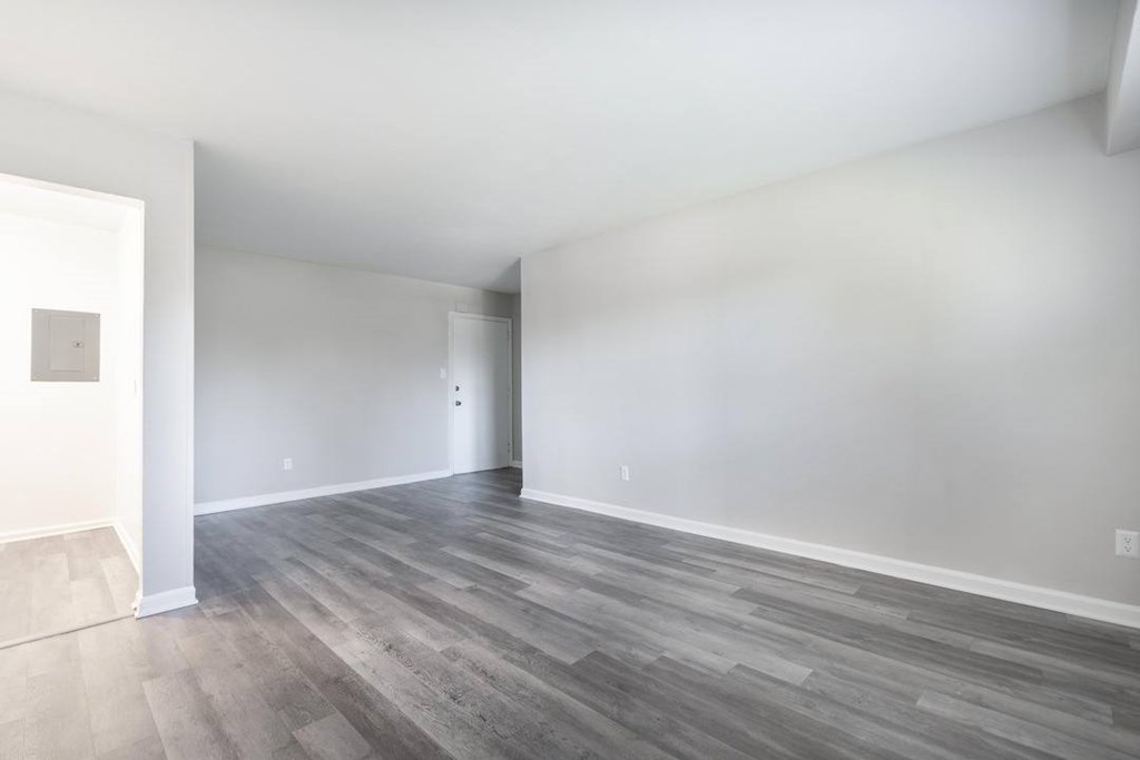 A room with a grey floor and white walls.