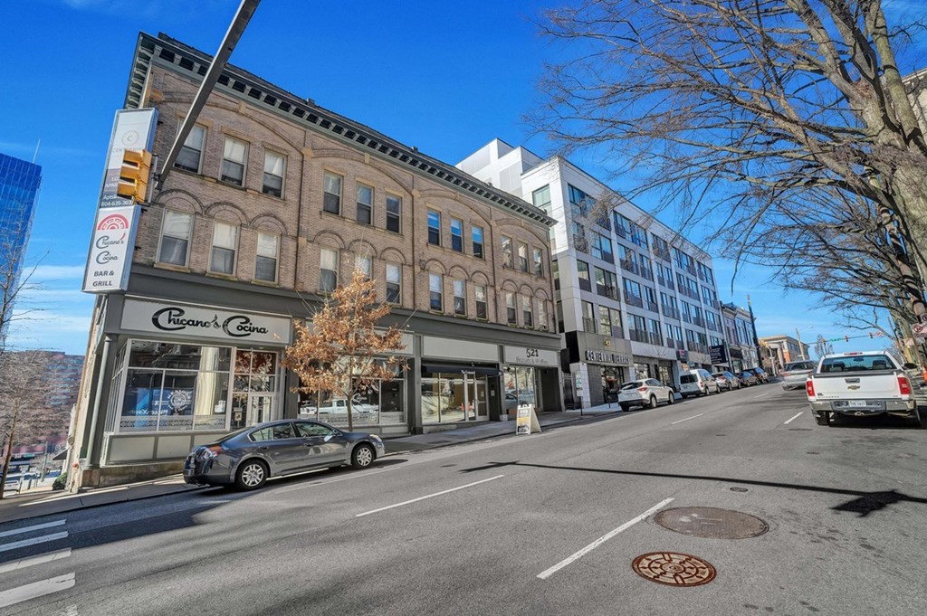 a city street with buildings and cars on it