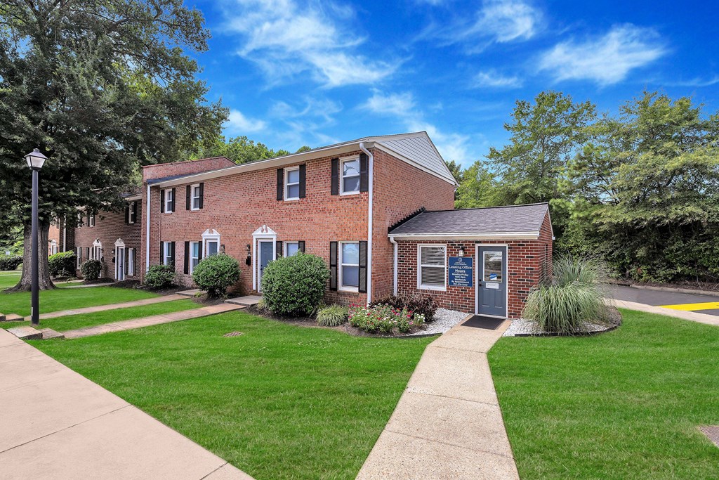 A brick building with a sign on it.