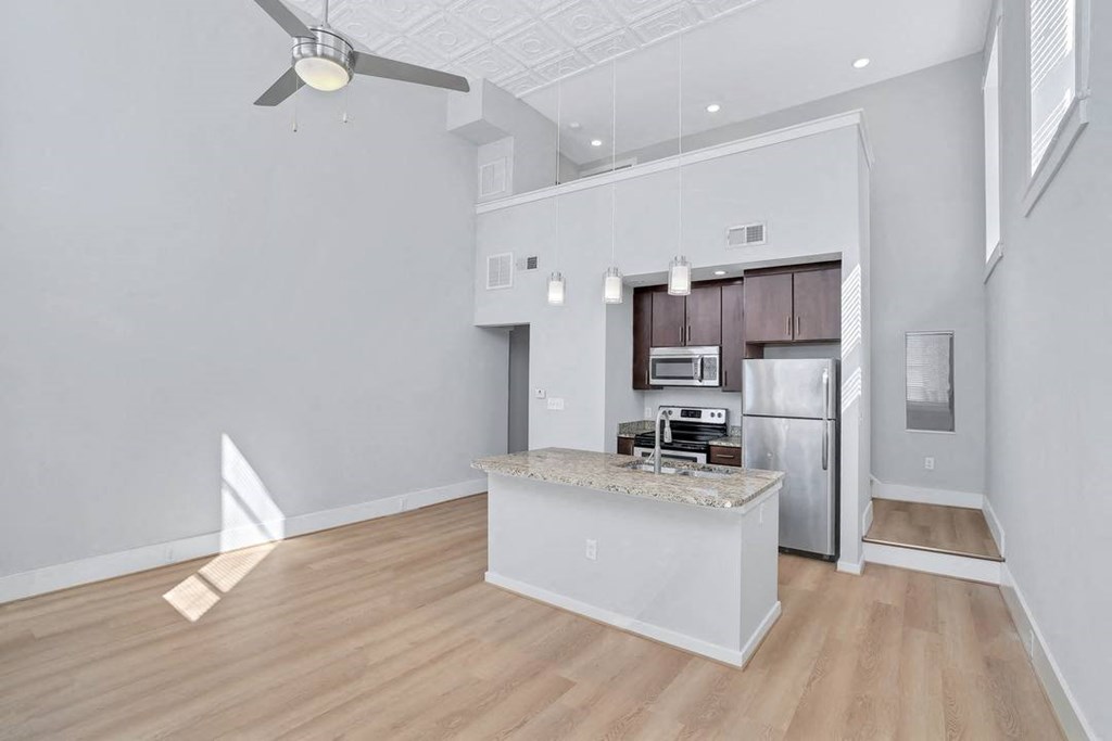 a kitchen with a counter top and a refrigerator