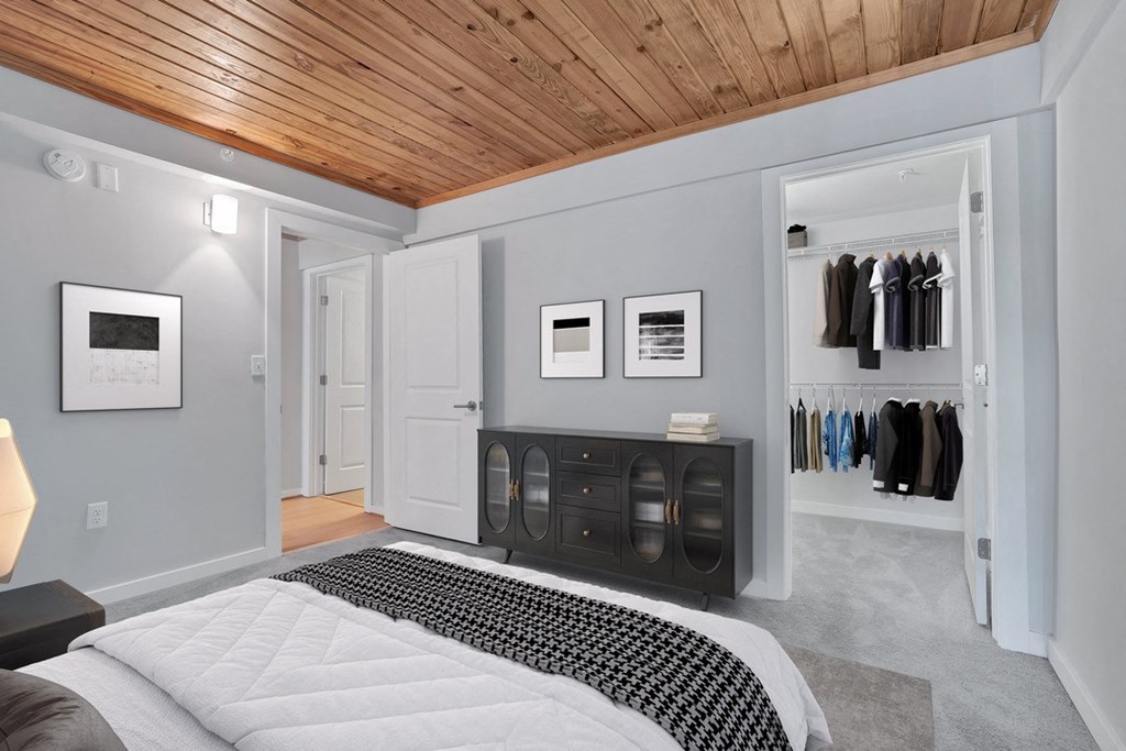 a bedroom with a bed and a closet