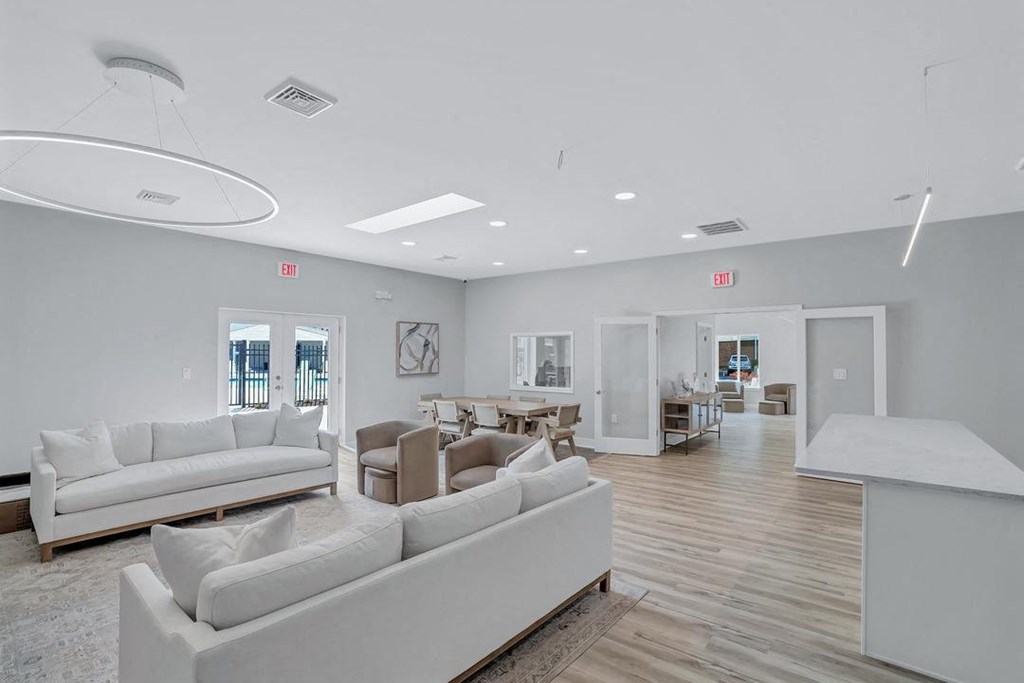 a living room with couches and chairs and a table