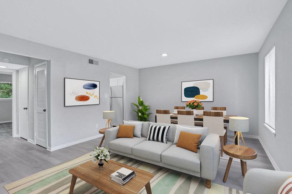 a living room and dining room with a couch and a table