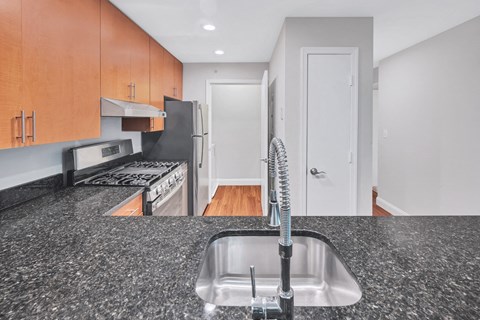 a kitchen with granite counter tops and a sink