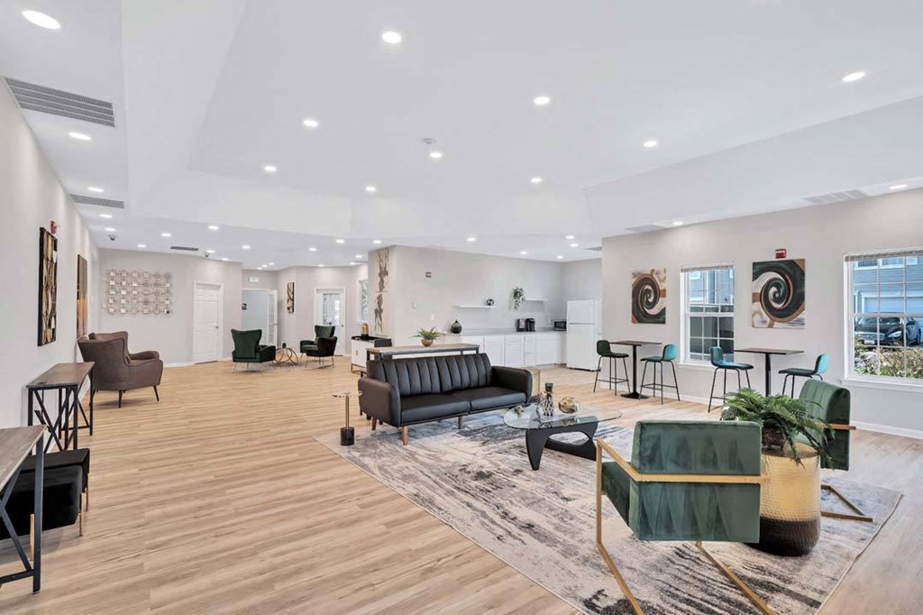 a living room filled with furniture and a large window