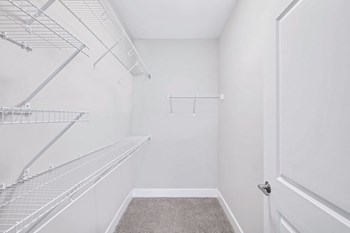 OverlookatRiverside_Interior_DouglasFloorplanBedroomCloset_GarlandGay2022 The walk-in closet in the Douglas floor plan at Overlook at Riverside. - Photo Gallery 5