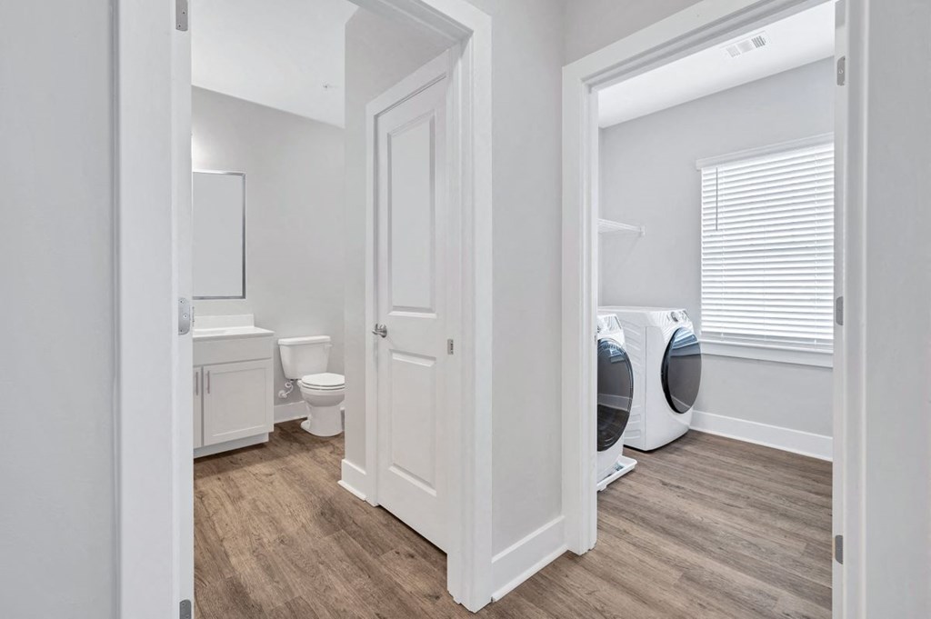 The bathroom and laundry room in the Sandstone floor plan at Overlook at Riverside.