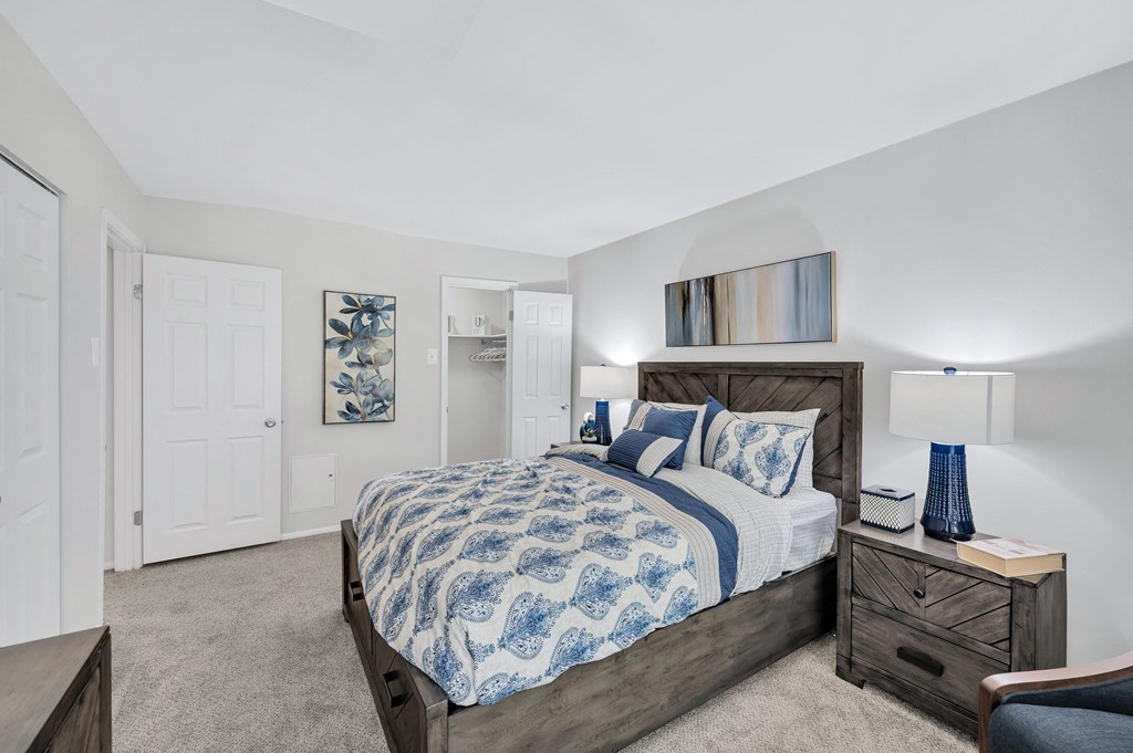 a bedroom with a bed and two night stands