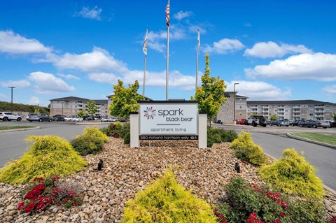 our sign in front of our building with our apartments in the background