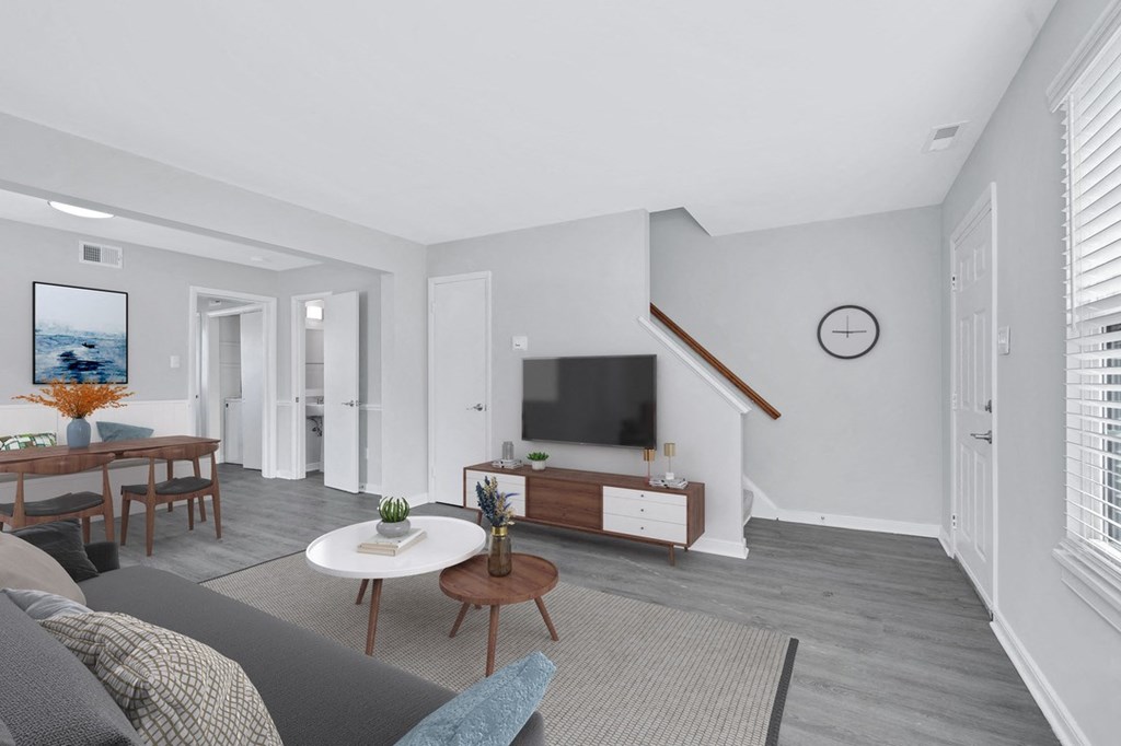 a living room with gray walls and a gray couch