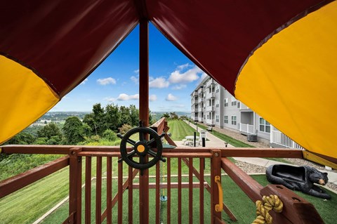 a view of a building from a balcony with a cannon