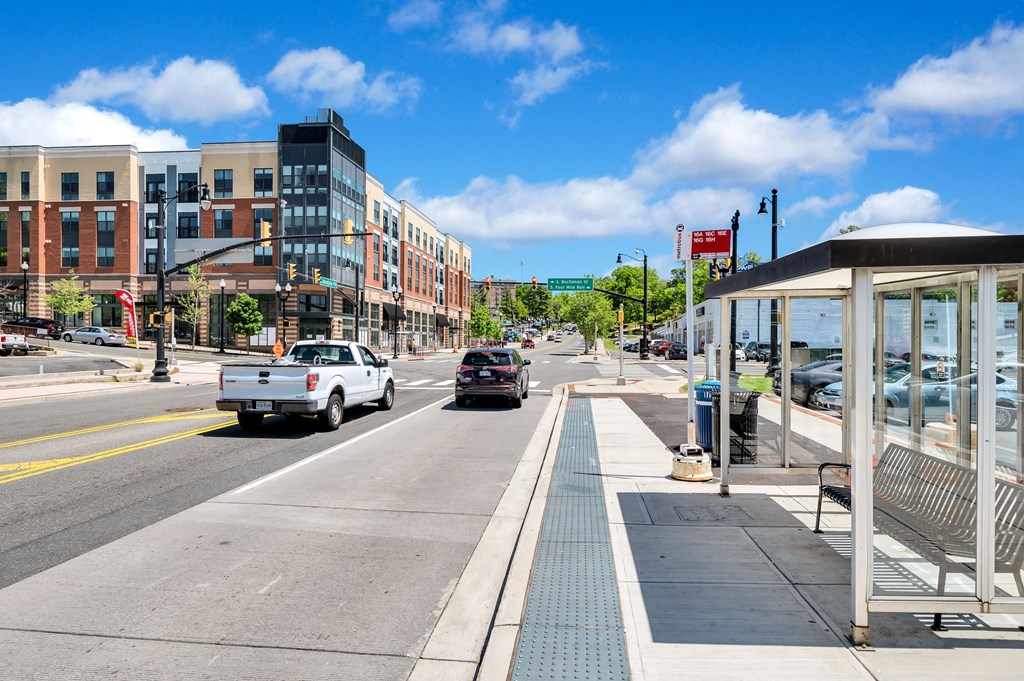 a bus stop on the side of a city street
