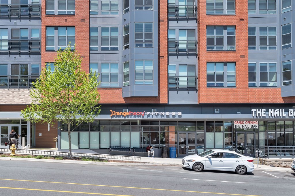 a car parked in front of a building on a city street