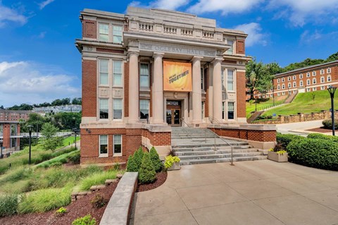 the facade of the college of medicine building on a sunny day