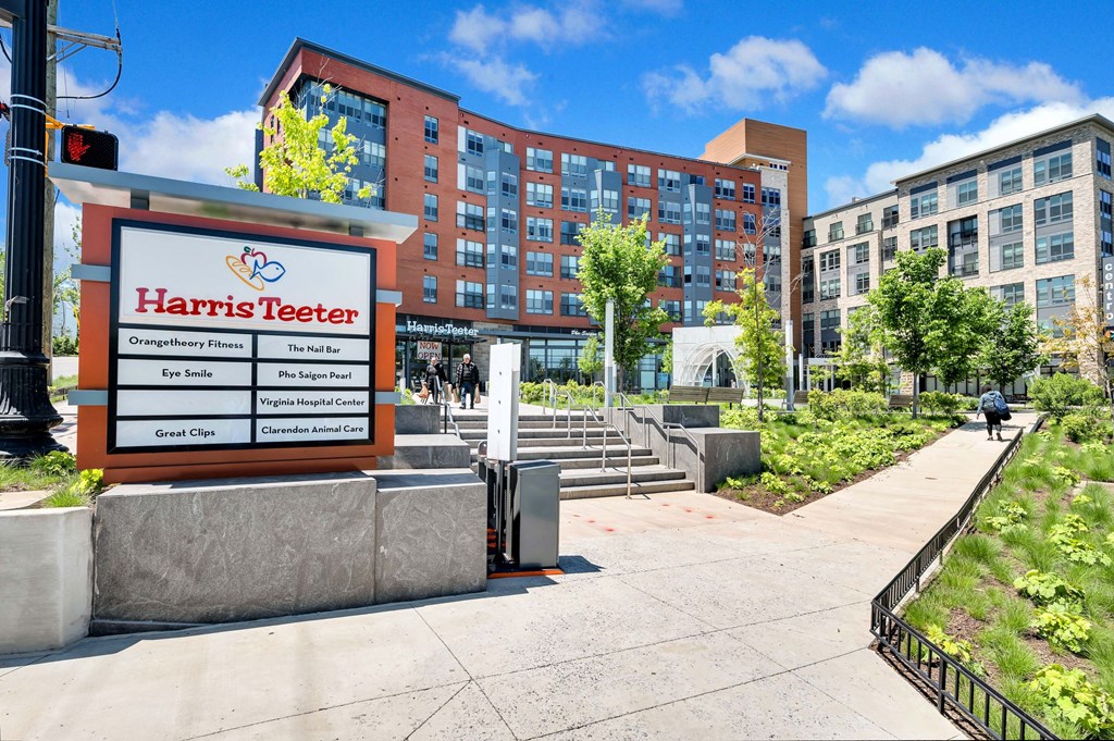 a harris teeter sign in front of a building on a sidewalk