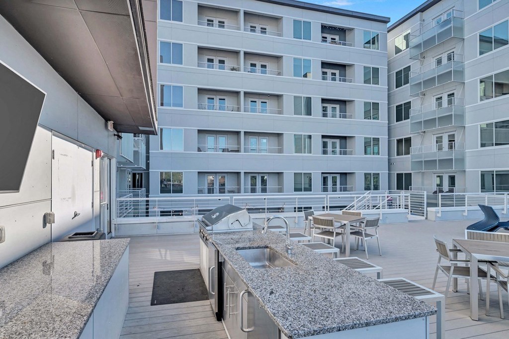 a kitchen with a sink in front of a building