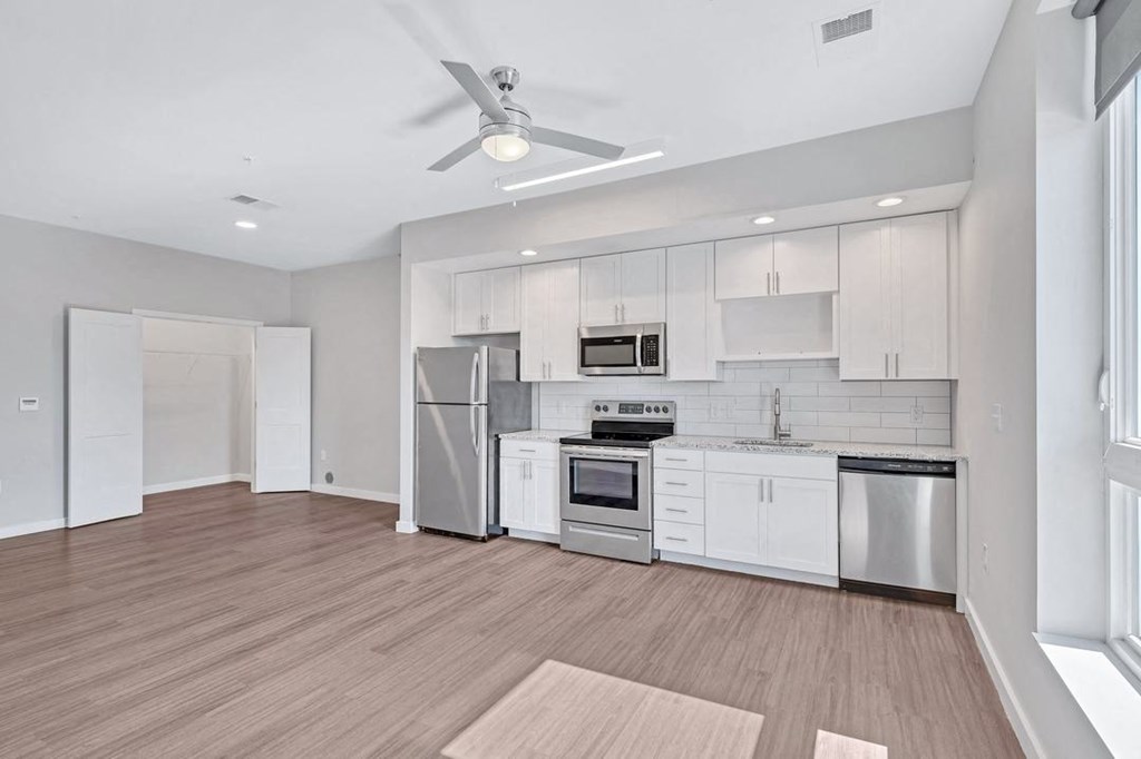 a dinosaur in the middle of an empty room