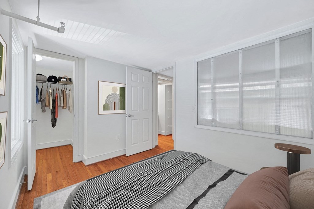 a bedroom with a bed and a closet