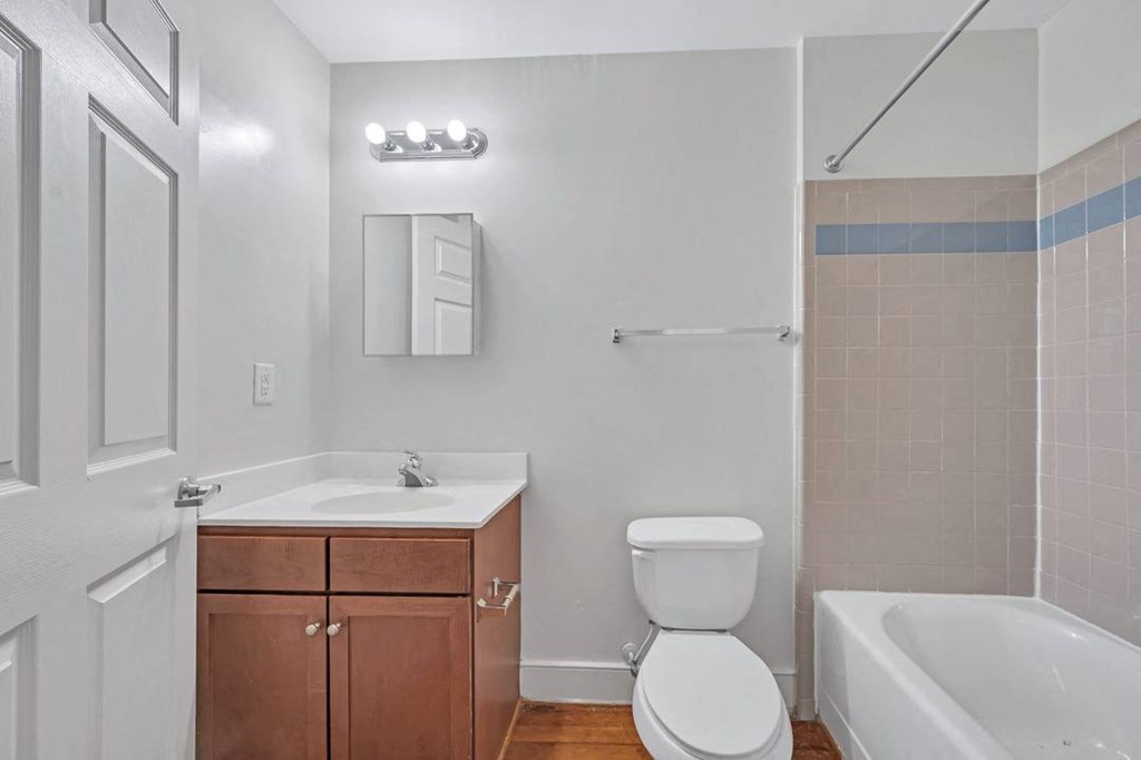 a bathroom with a sink toilet and bathtub