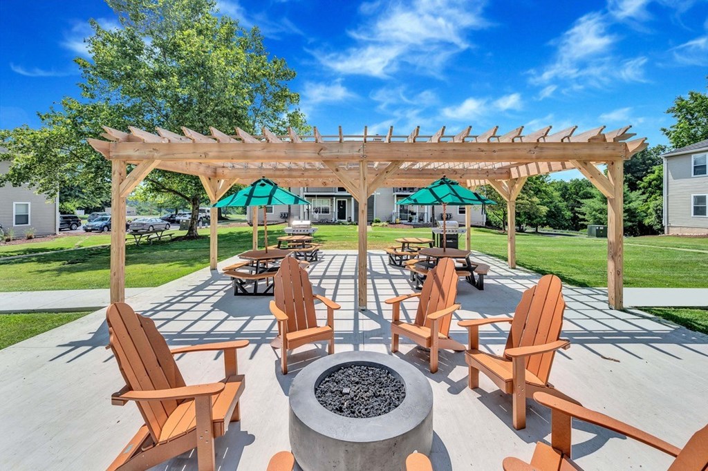 Cozy fire pit with seating and covered grilling pavilion